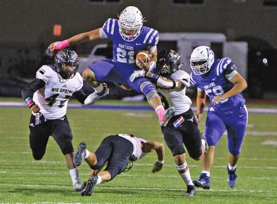 Fort Stockton signal caller Dominic Aguilar hurdles over a Big Springs defender in a home contest on Oct. 23, 2020. Aguilar was his team’s leading rusher by a considerable margin a season ago. Photo by Nathan Heuer