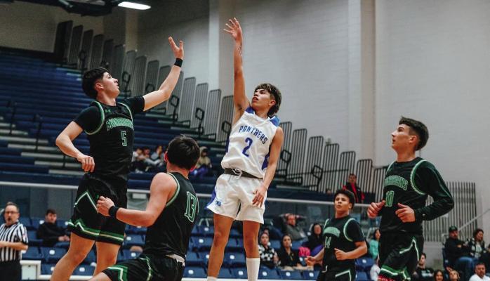 Jondrey Reyes shoots for the basket over an opponent's head, adding to the 99-32 victory over Monahans on Friday. Photo by Aaron Owens