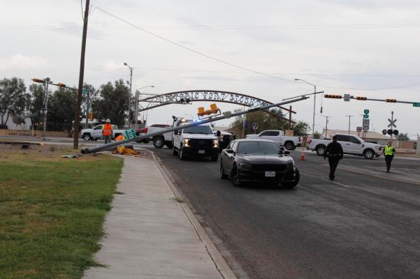 A stoplight was downed by a semi hauling an oversize load on July 13 at the intersection of Dickinson and Main Street. Photos by Nathan Heuer