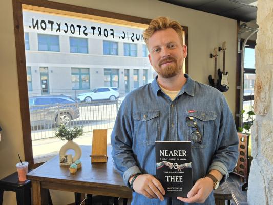 Aaron Owens at his first book signing hosted at Ru Coffee Co. in downtown Fort Stockton, TX. Courtesy Photo by Tristian Barragan