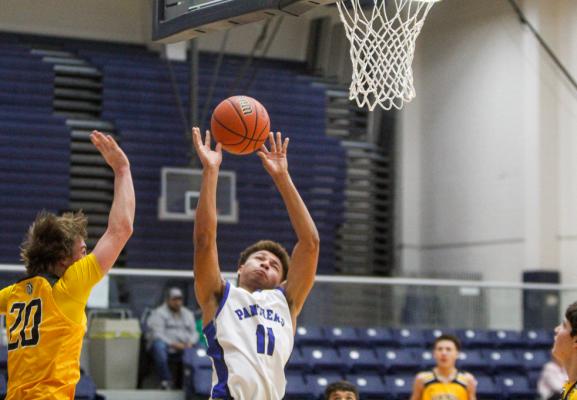 enior Isaiah Garcia (11) fights through contact for a shot attempt in the second of Monday’s game against Seminole. Garcia was fouled on the shot and went 0-of-2 at the free throw line following the foul. Photo by Nathan Heuer