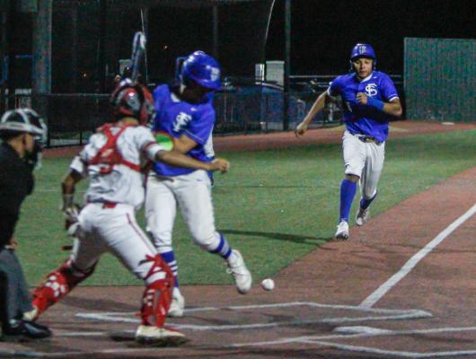 Fort Stockton senior Isaiah Garcia (18) steals home while Gerry Diaz (15) moves out of the batters box after a pitch in the dirt that the Denver City catcher was unable to secure in time for the tag. Garica was a pinch runner in the third inning. Photo by Nathan Heuer