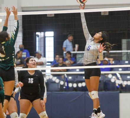 Eliana Mata tips an attack over the Fort Davis block during the Prowlers home match on Sept. 13. The senior setter and outside hitter is primed for district play and the last half of her high school volleyball career. Photo by Nathan Heuer