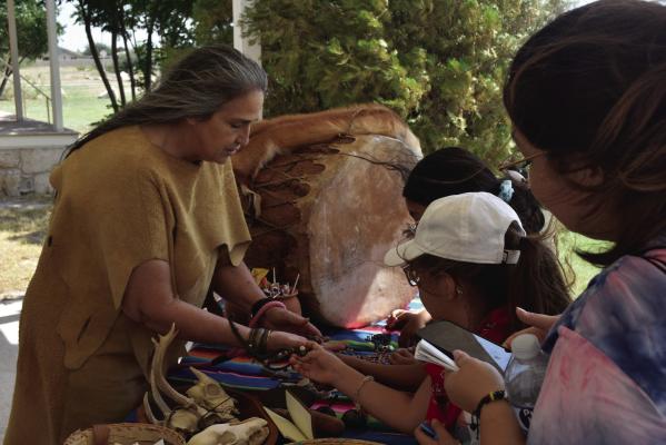 Liz Flores, the Jumano tribe educational director, joined the impressive lineup of educators for the Forts and Frontier Day. Hosted by the Fort Stockton Historical Site, local children were taught about the Fort’s history and origins of the city with activities and games led by reenactors and historians. Photo courtesy of the Fort Stockton Historical Society