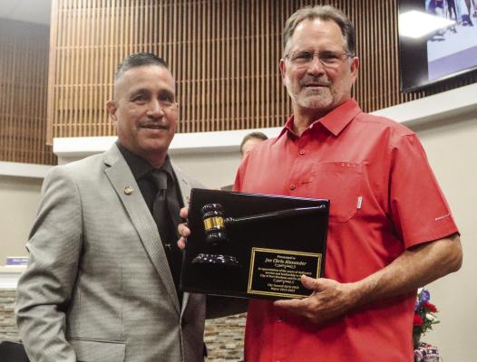 New Fort Stockton Mayor Paul Casias, left, presented out-going Mayor Joe Chris Alexander with a gavel for his final meeting as Mayor, Monday. Alexander was elected to the city council in 2010 and was mayor from 2015 to 2023. Photo by Shawn Yorks