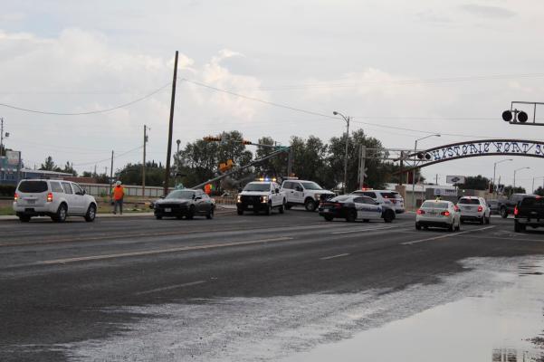 A stoplight was downed by a semi hauling an oversize load on July 13 at the intersection of Dickinson and Main Street. Photos by Nathan Heuer