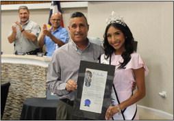 Fort Stockton City Mayor Paul Casias presents Miss Fort Stockton Aubrie Salgado with the honor of a proclamation at the recent city council meeting. Photo by Joh Covington