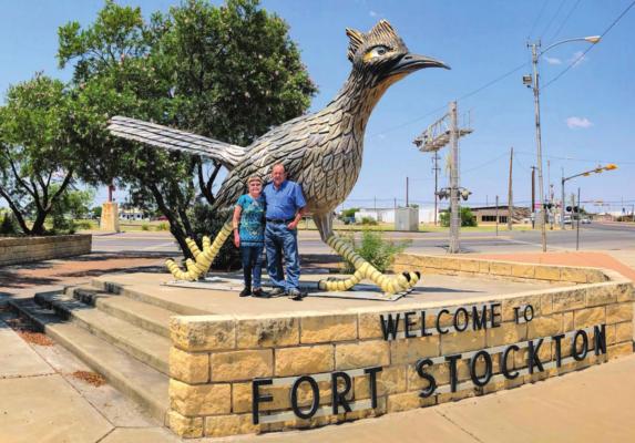 Marian and Bill of Austin stopped to take pictures with Paisano Pete during their romantic “do-nothing” trip to West Texas. Photo by Jeremy Gonzalez