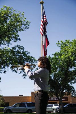 PLAYING OF TAPS - State winner and recent FSISD grad Zoe Alvarez performs a moving rendition of Taps to conclude the morning’s program. Photo by Tristian Baragan