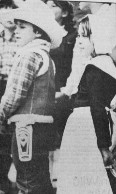MARCH 1982- Parents and friends were taken back a time in history Monday night at Open House of Apache Elementary School as third grade students of Becky Peacock presented a musical history program. All of the students were in costume, including two of the narrators (center of photo), Brian Fairchild as a cowboy, and Tracy Penn, the pilgrim.