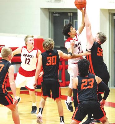 Iraan’s Angel Zapata drives to the basket during the Braves home contest against Wink on Tuesday, Dec. 8. Zapata finished the game with one point. (Photo by Jessica Rodriguez)