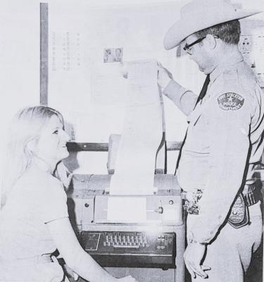 APRIL 1971- NEW TELETYPE- Looking at the new instant communication teletype which the Fort Stockton police Department 