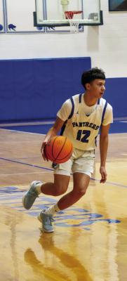 Fort Stockton JV guard Frankie Ramos brings the ball up the floor during the Panthers’ home game at Panther Gym. Courtesy Photo