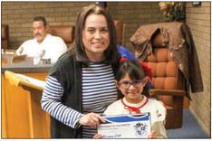 Viviana Soto, right, was recognized as the Alamo Student of the Month by principal Linda Chavez.