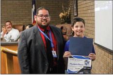 Intermediate Principal Julian Castillo presented Chrystopher Bowman with his Student of the Month award for October at Monday’s meeting.