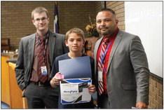 Haizen Gregory, middle, was recognized as the Middle School Student of the Month at Monday’s meeting. Gregory was presented his award by campus curriculum director Timothy Carter, left, and Middle School Principal Sammy Soliz.
