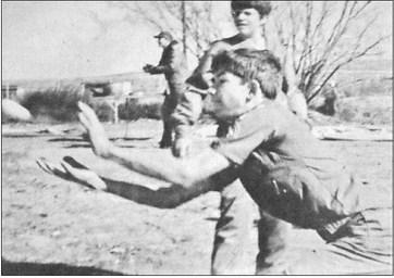 December 1974 … This intense Boy Scout is watching the projectile just in front of him with great caution – and with reason. It’s a raw egg. The boys are in the midst of an egg-throwing contest, one of the competitive events at last weekend’s camporee at Iraan. Object of the game is for two boys to play Catch with an egg, and each time they complete a pass with it, they have to move further apart. The winners are the last two-boy team to drop the egg or get splattered.