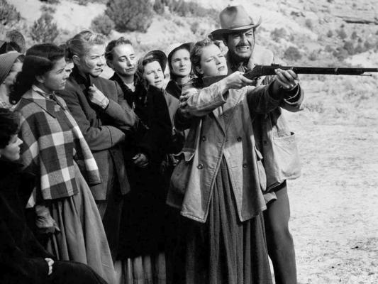 Robert Taylor teaches the women on the wagon train how to shoot, in Westward the Women, showing this Saturday at 4 pm at the Nelson Street Theater.