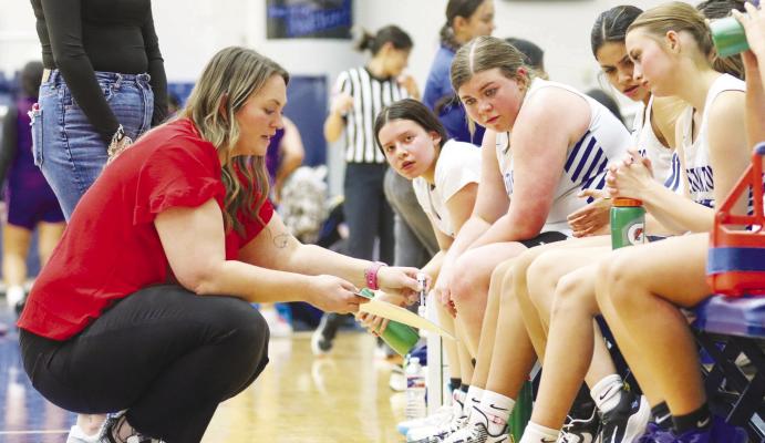 The Fort Stockton High School junior varsity girls basketball team attentively listens to coach Meagan Villanueva as she draws up a play during a timeout of the JV girls’ game last Friday night at the Bill and Virginia Special Events Center in Fort Stockton. The JV Prowlers defeated the Pecos junior varsity Eagles, 42-23. See a full recap on the high school girls’ and boys’ basketball teams, as well as softball and powerlifting reports, in Sports, pages 8-9. Photo by Shawn Yorks