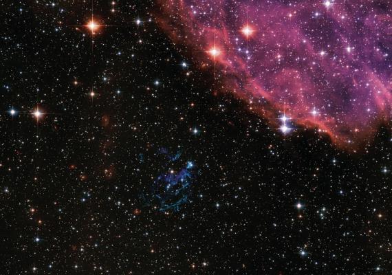 In the nearby Small Magellanic Cloud galaxy, this massive star exploded as a supernova and dissipated into its interior, resulting in a spectacular display of colored filaments. This supernova remnant, known as E0102, is the greenish-blue field of debris just below the center. Supernova Remnant E0102 Photo courtesy of NASA