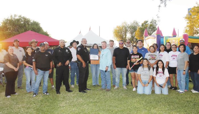 The Fort Stockton Police Department presents National Night Out recognitions to representatives of the First National Bank and Pecos County State Bank for hosting this year’s community event.