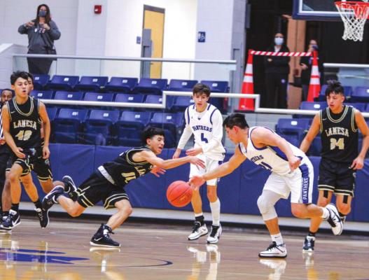 Fort Stockton junior Dominic Aguilar, right, battles for a loose ball during Friday’s home game against Lamesa at the Special Events Center. (Photo by Nathan Heuer)