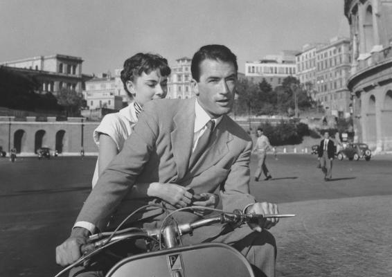 Gregory Peck and Audrey Hepburn buzz around Rome via Vespa in the Hollywood classic romance, Roman Holiday. Courtesy Photo