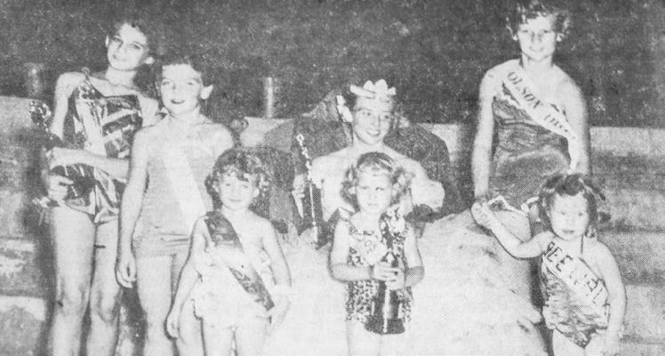 July 1954: BELLES OF TOMORROW – Not too many years ago, Queen Luann Dyche was a “Tiny Tot” contestant in the Fort Stockton Water Carnival. This year, she was the gracious queen, and shared her throne for this picture with several winners in the Junior and Tiny Tot divisions. From left are Melody McKenzie, winner of the Junior Division; Betty Jack Cooper, Pollyanna Price, Patsy Bynum, winner of the Tiny Tot division; Becky Nell Shannon, and Mary Frances Reeves.