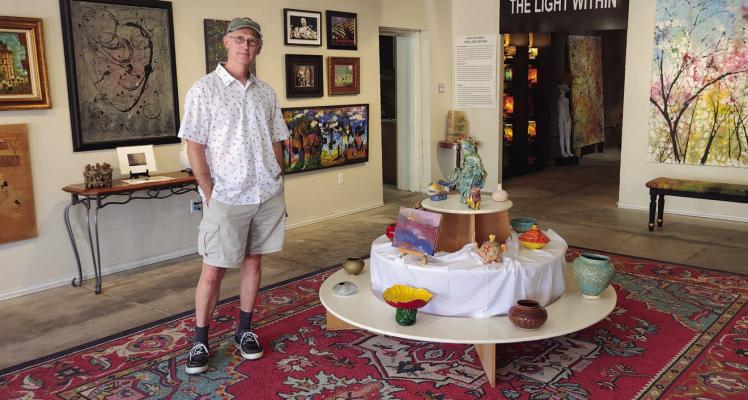 Steven Walker in his gallery on 1st street. Photo by Joh Covington