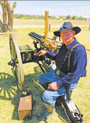 Gary Harper was only passing through town, but car troubles found him staying longer than anticipated. He just happened to have his 1874 Gatling gun handy to participate in the two-day event held at the fort last week. Photo by Jeremy Gonzalez