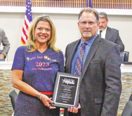 Pam Pepper Palileo was presented an admiration and appreciation plaque by Fort Stockton Mayor Chris Alexander on May 17 at the city’s council special meeting. Alexander stated that the plaque was given to Palileo for her exceptional commitment and distinguished service to the citizens of Fort Stockton during her two terms on the council (May 2018-May 2022). Photo by Nathan Heuer