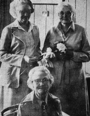 January – 1979 — NEW OFFICERS - Officers of The Pioneer Club, one of the oldest clubs in Fort Stockton, took office for the 1979 sear at a meeting held in the home of Mrs. Karl Butz on Jan. 19. In the photograph, Mrs. Frank Daniels, outgoing president, presents a longstemmed carpation to Mrs. Marsha Daggett, the new president of the club. Seated is Mrs. Minnie Dunn, second vice-president. Mrs. Butz, not pictured, will serve as first vice-president. [Pioneer Photo]