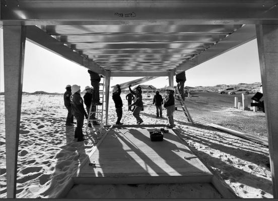 Volunteers from The Great Outdoors Fund (TGOF), Occidental (Oxy), and the Texas Parks and Wildlife Department (TPWD) install one of the new shade structures at the Willow Draw Campground in Monahans Sandhills State Park, Texas, this week. The new shelters are part of a public-private partnership to provide seating and shade, aiming to protect visitors from extreme temperatures and improve safety at the park. Courtesy Photo