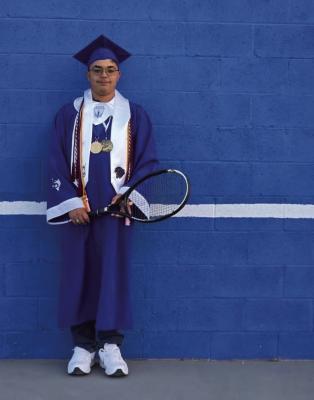 TENNIS TRADITION - Fort Stockton High School Valedictorian Alexander “Xander” Gomez poses with his tennis racket in his graduation cap and gown, continuing the Panther Tennis program’s long-standing tradition of excellence in both academics and athletics. Courtesy Photo.