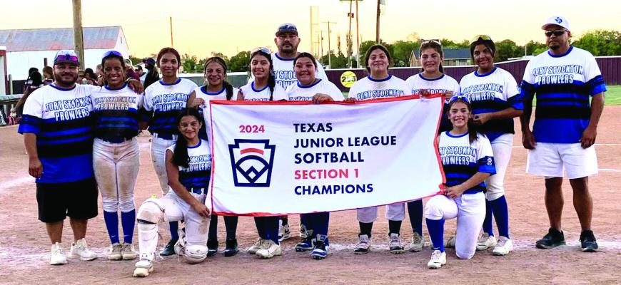 Fort Stockton 14U Junior Softball Team posing with their Sectionals Championship Banner. Photo by Fort Stockton Recreation