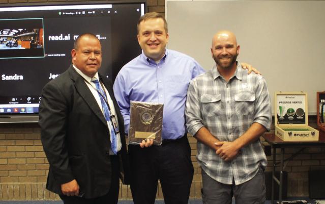 Two representatives from Chevron, Jonathan Harshman and Russel Gregory, were presented with a plaque in recognition for their generosity to the FSISD community and students during the recent school board meeting. Photo by Kerry Waldrip
