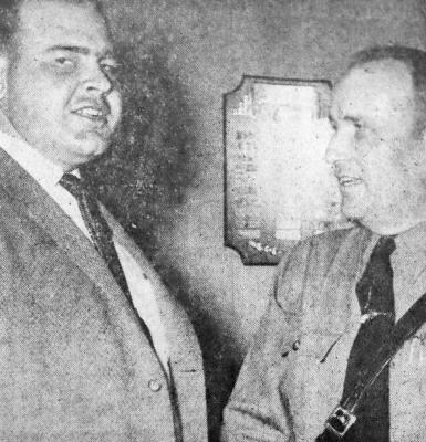 February 1958: WINS AWARD – Fort Stockton Jaycee president Dennis Card, left, and highway patrolman Howard Colson make with smiles following Jaycee recognition of Colson’s being named the state’s top patrolman for 1957 by the Texas Safety Association.