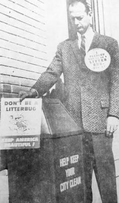 February 1958: ANTI-LITTER – Fort Stockton Mayor Walter Buenger is well-equipped with placards to herald the beginning of a continuing city cleanup campaign sponsored by a score of civic organizations. The can is where the refuse belongs.