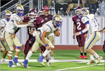 Buena Vista quarterback Jackie Jurado breaks through a gap created by the Longhorn offensive line during Friday’s 80-47 win at Sierra Blanca. The win gives the Longhorns a 2-2 record for the season so far, and the team will be back on the road this week to face Balmorhea (2-2). After an open week Sept. 29, Buena Vista will travel to Meadow on Oct. 6 before returning back to Imperial on Oct. 13 to face Midland Texas Leadership Charter Academy. Courtesy photo by Staci Schoenfeldt