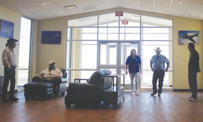 The Fort Stockton-Pecos County Airport held a ribbon cutting for its new terminal on Saturday morning, with county officials, Chamber of Commerce members, friends and family of the airport staff, and Miss Fort Stockton Audrey Mendoza on hand to help the airport celebrate. Paintings inside the new terminal celebrate Fort Stockton’s history as an Army Air Force training base during WW 2. Photos by Shawn Yorks