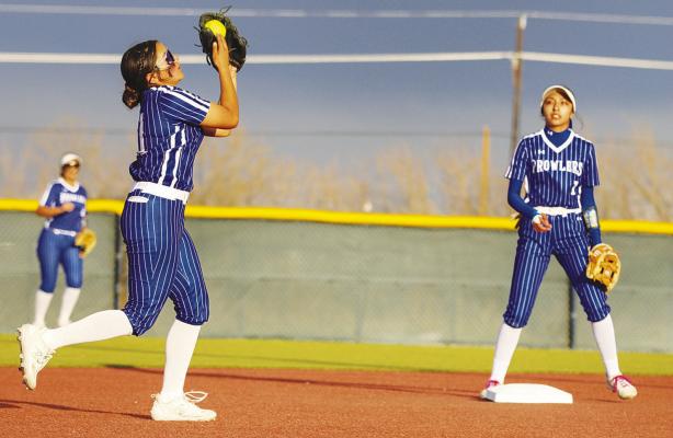 Kriselda Porras catches a line drive at shortstop, Friday against Greenwood. Photos by Shawn Yorks