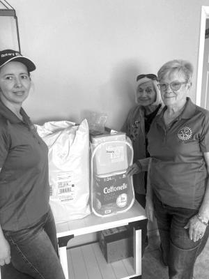 Rotarians Catalina Riley, Ann Hurt and Alice Duerksen prepare welcome baskets for visitors of the Lilah Smith Safe House, a nonprofit dedicated to offering shelter, support, and safety to women and children escaping abusive situations. Courtesy Photo