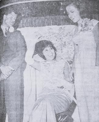 July 1965-GALA OCCASION-Delma Lujan queen of the Fiest San Juan, reposes in splendor at her crowning Sunday night at the coronation ball.
