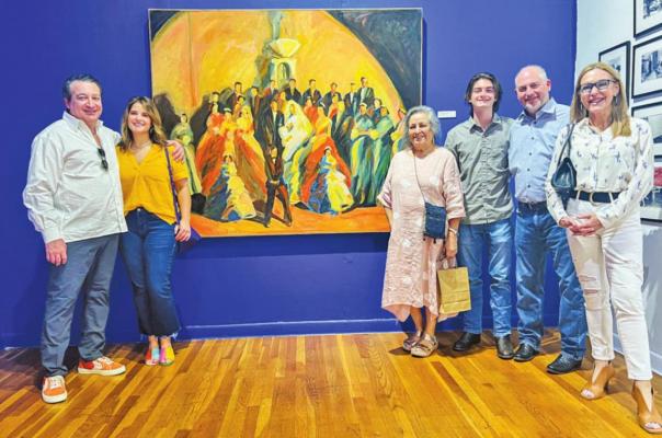 Fort Stockton native and artist Carolina Flores stands with visitors next to her painting entitled “Boda en Sanderson.” From left to right: Greg Sapire, Ana Boza, Carolina Flores, Antonio Soltero, Carlos Soltero and Elizabeth Rogers. Photo courtesy of Carolina Flores.