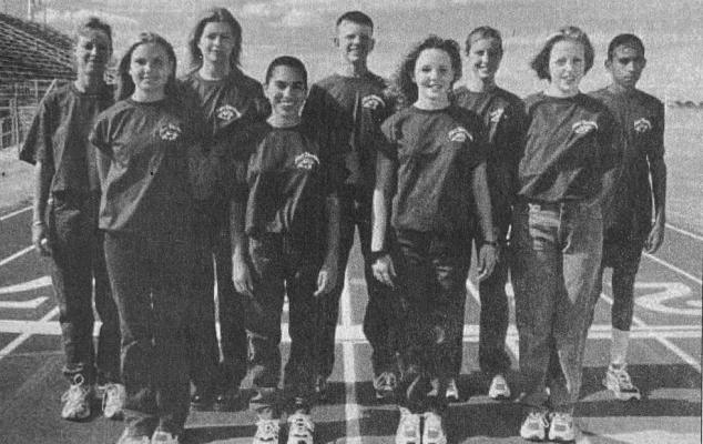 Making up the 1999 FSHS Cross Country team are: (Front, l-r) Yvonne Czarnecki, Betsy Rodriguez, Hesper Lehnert, Bethany Gordon, (back) Coach Gutierrez, Tasha Harbour, Timothy Hayter, Elena Hernandez, and Jose Rodriguez. Not pictured is Mario Rocha.