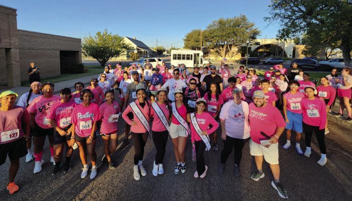 The Stonger Together 5k event saw a large turnout, with community members of all ages participating, united in their support for breast cancer survivors and the ongoing fight for a cure. Participants received T-shirts and flags to decorate “Pink Out Lane,” honoring those affected by breast cancer. Photo by Tristian Barragan