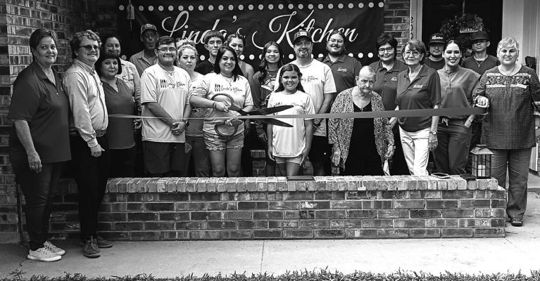Linda Esquivel (center) cuts the ribbon during the grand opening of Linda’s Kitchen on June 30, 2025, joined by Fort Stockton Chamber of Commerce representatives, ambassadors, and board members. The Chamber presented the business with its official membership plaque. For menu details and hours, visit Linda’s Kitchen on Facebook or call (432) 290-4340.