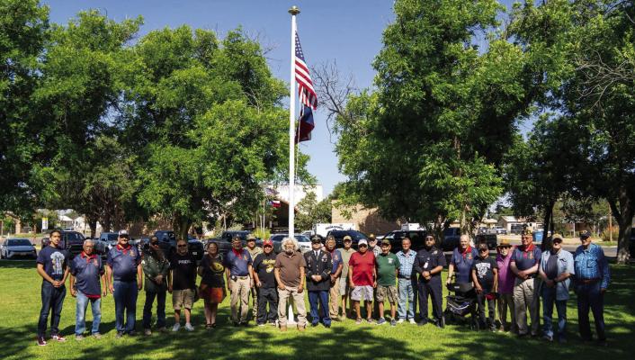 Local veterans gather at the Zero Stone Park flagpole for a group photo following the Fort Stockton Memorial Day Remembrance Ceremony. The ceremony, which included the reading of city and county proclamations and the laying of new commemorative wreaths, served as a solemn tribute to those who made the ultimate sacrifice in service to the United States. Photo by Tristian Barragan