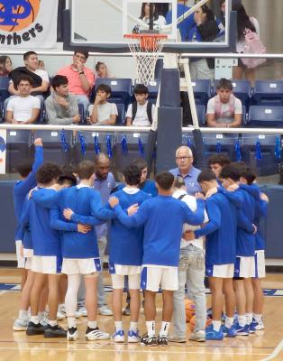The Panthers gather in prayer before their opening tip-off under new head coach Marcus Klingsick. Photo by Tristian Barragan, Fort Stockton Pioneer