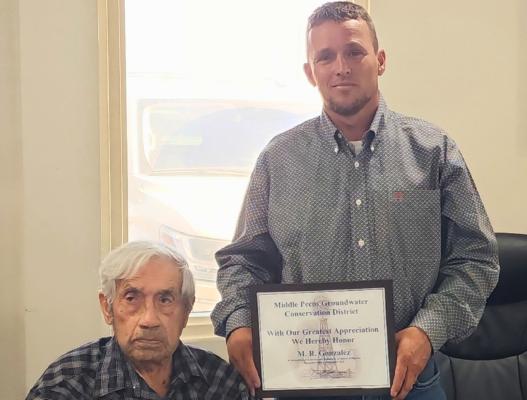 General Manager Ty Edwards presented M.R.Gonzalez with an appreciative plaque thanking him for his dedicated service to the board as a standing director.